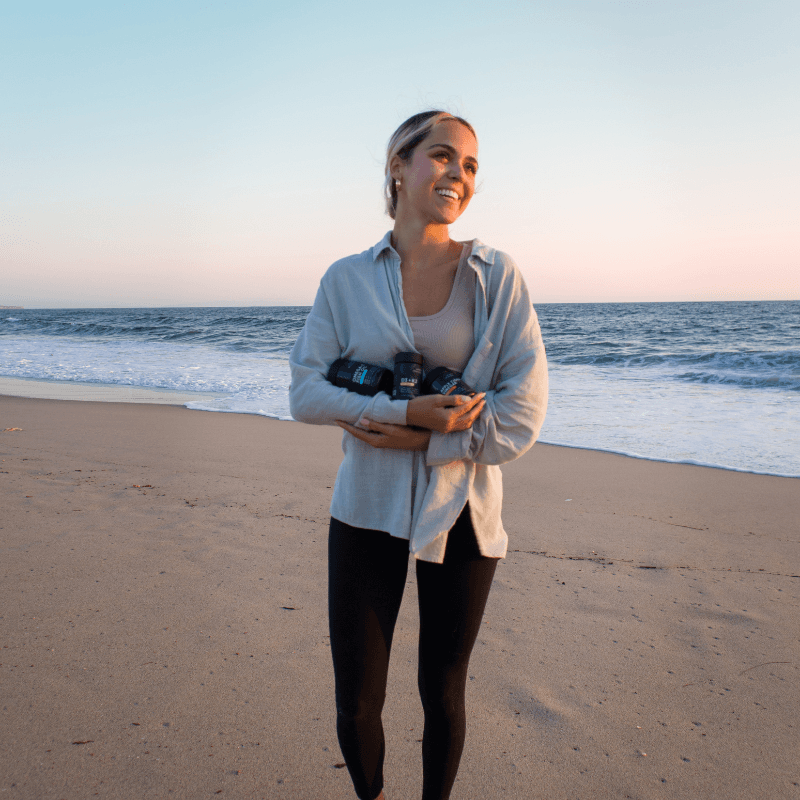 Woman carrying supplements on the beach